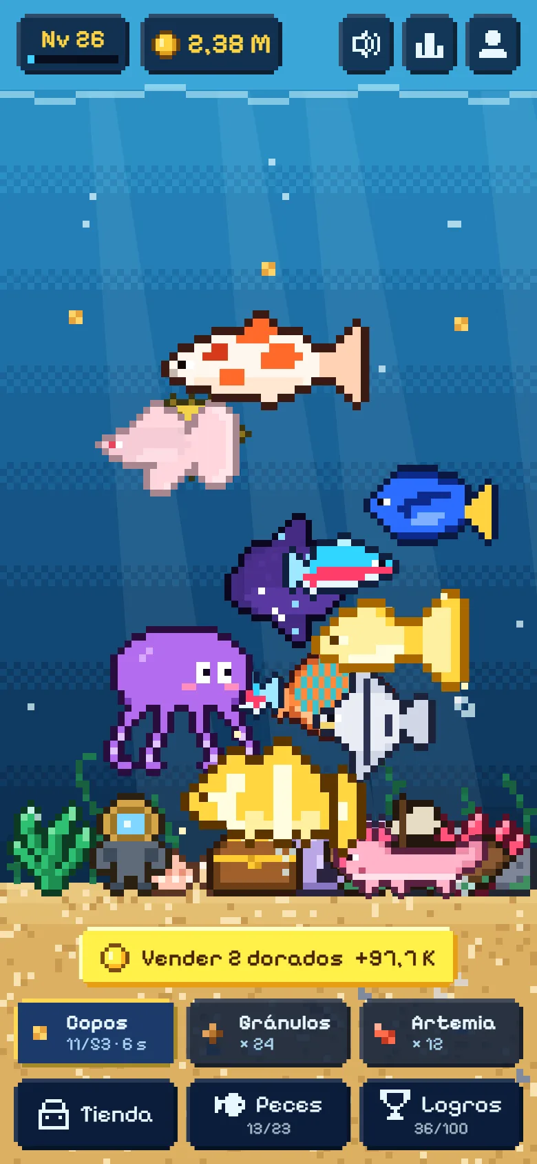 El acuario de Esquarium con peces de colores comiendo y decoración en la arena
